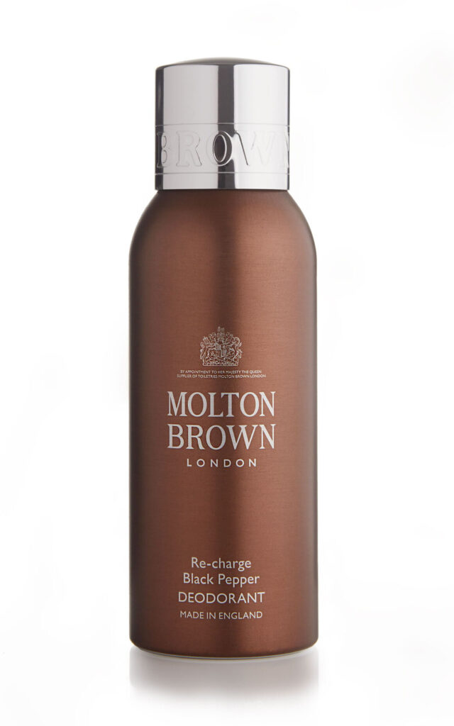 A professional packshot product photograph of Molton Brown Black pepper deodorant on a pure white background