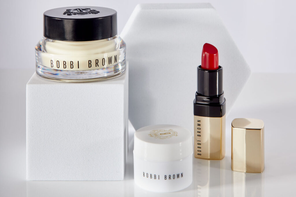 A professional ecommerce product photography picture featuring 3 Bobby Brown cosmetic products
